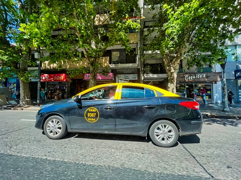 buenos aires, Argentina - 27 October 2022: argentine taxi cab on the daytime street in downtown
