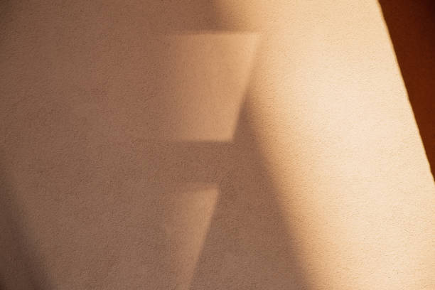 istock background of wall with sunlight and shadow 2016372357