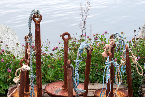 Metal anchor on a blue background