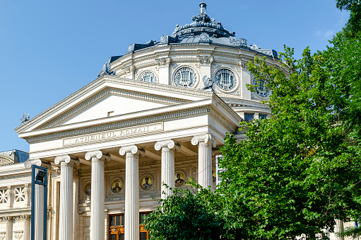 Bucharest, Romania – June 21, 2023: Romanian Athenaeum founded in 1865 and opened in 1888, a concert hall in the center of Bucharest and a landmark of the Romanian capital city.