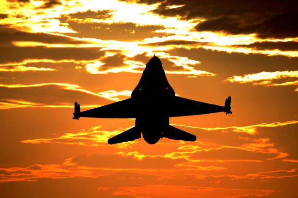 istock In Front of F16  fighter jets flying on Sunset 2016490786