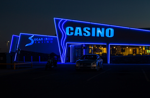 Hinton, Oklahoma - October 19th, 2022: Sugar Creek Casino building illuminated at dusk
