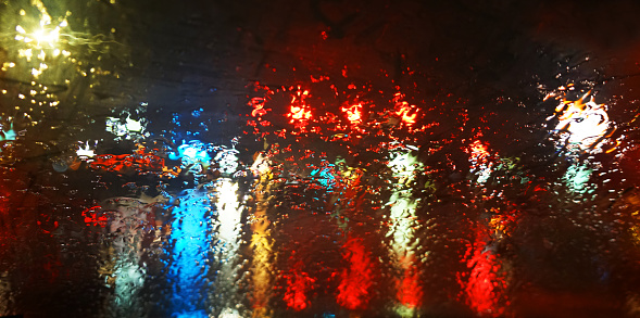 street night view in rain through car window