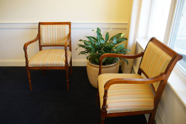 istock armed chairs in the corner of room 2016558915