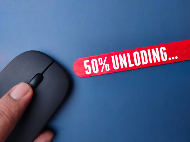 istock Wireless mouse and colored stick with the word fifty percent unloading 2016562498