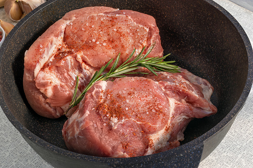 Raw pork meat before baking in oven.