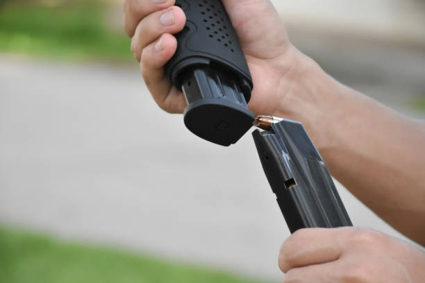 istock 9mm pistol gun and bullets 2016590672