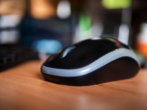 istock Close-up of a Wireless Computer Mouse on Desk 2016636214