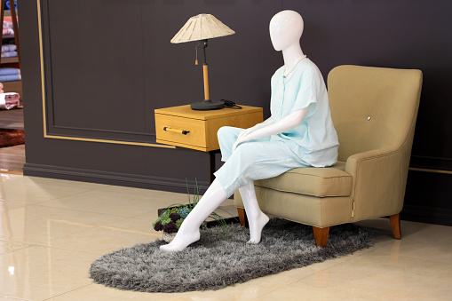 The female model sitting on the sofa is in a store, North China