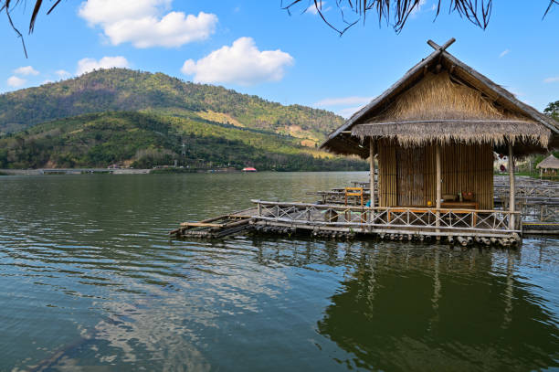 Floating raft houses and Wooden Rural huts in Laos. stock photo