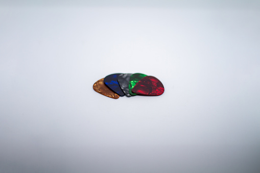 guitar picks of multiple colors and thicknesses