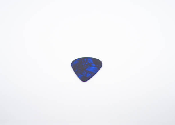 istock blue colored guitar pick and an abstract design 2016652681
