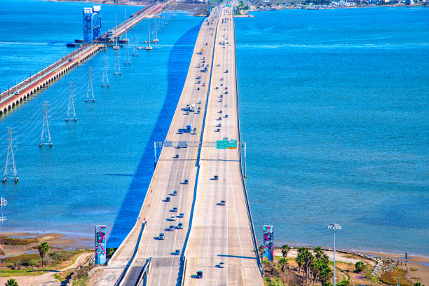 The Galveston Causeway, named  the George and Cynthia Mitchell Memorial Causeway, linking Galveston Island with the Houston metropolitan area shot via helicopter from an altitude of about 600 feet on a sunny afternoon