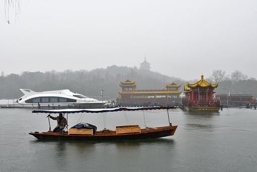 the West Lake has gained a worldwide reputation for its picturesque lakes and hills as well as a myriad of places of interest in Zhejiang province, China.