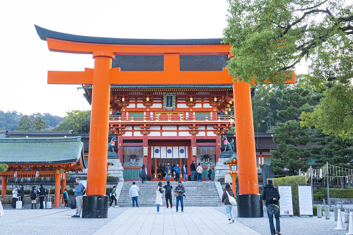 Kyoto, Japan - Nov 19 2023 : Giant Torii Gate in front of the Romon Gate of Fushimi Inari Shrine