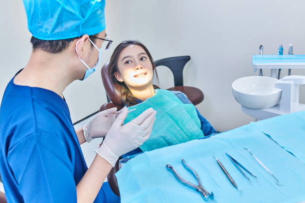istock Dentist Examining Teeth to Female Patient 2016753918