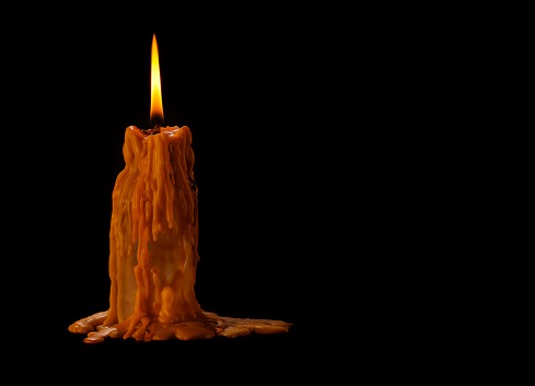 Candle with dramatic smoke background and lighting effects and antique colours Thailand Asia