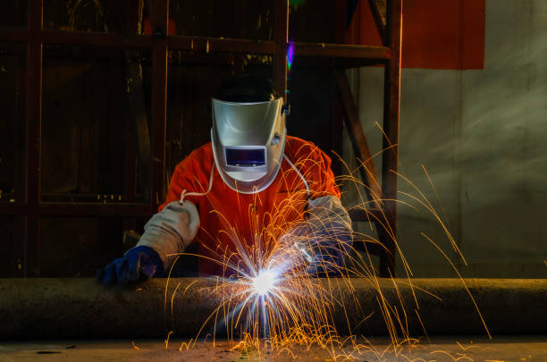 istock Welder working with electrode at semi automatic arc welding in manufacturing production plant. 2016792863
