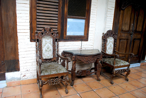 Old Javanese style carved table and chairs belonging to a photographer.