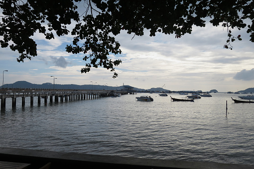 [Phuket] Morning scenery of Chalong Bay with a long pier.