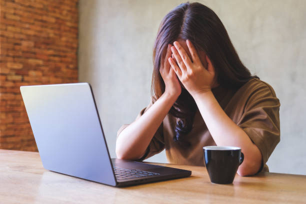 istock A woman get headache and stressed while working online on laptop computer at home 2016845958