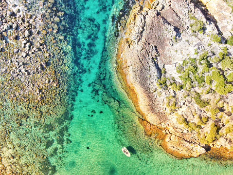 A lone boat floats in the channel at kianinny bay