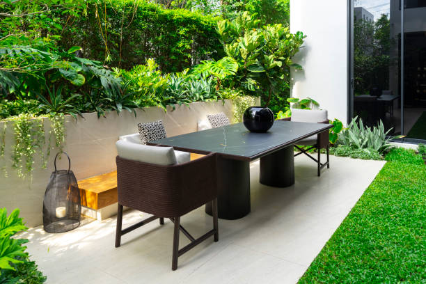 istock Backyard outdoor garden patio with modern wicker sofa and pillow. 2016929830
