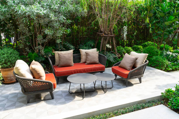 istock Backyard outdoor garden patio with modern wicker sofa and pillow. 2016929832