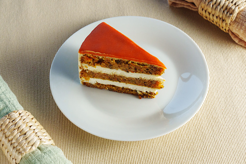 Deliciously Moist Carrot Cake Served on a Clean, White Plate