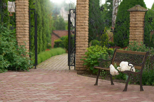 istock Garden bench surrounded by lush spring vegetation 2017024278