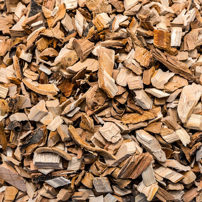 Apple sawdust for smoking in close-up. Texture and pattern of wood chips