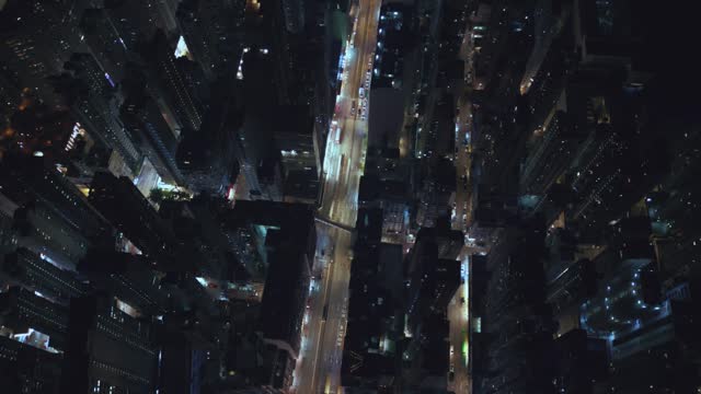 Aerial view of the cityscape with a crowd of buildings on Hong Kong Island at night