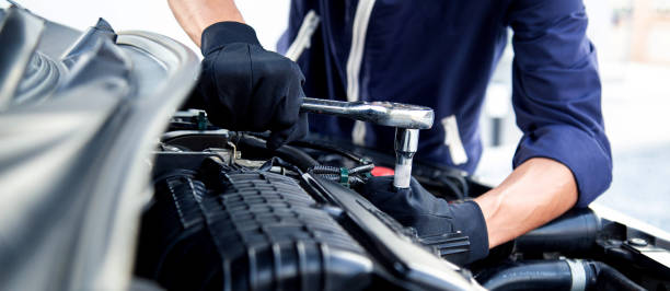 istock Professional mechanic working on the engine , repairing a car engine automotive workshop with a wrench, car service and maintenance,Repair service. 2017068984