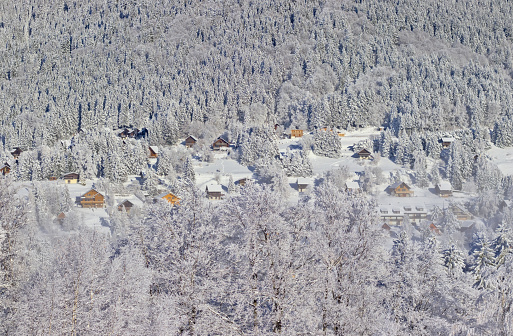 Beatiful snowy scenery at the french village of La Morte during cold winter day, close to L'Alpe du Grand Serre ski resort.