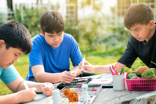 istock Asian boys with painting 2017118272