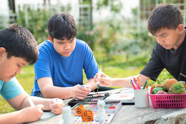 istock Asian boys with painting 2017118273