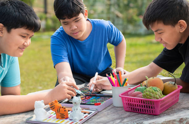 istock Asian boys with painting 2017135954