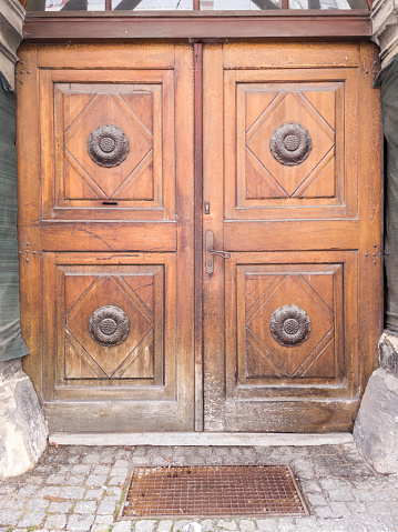 Old wooden door with a geometric pattern.
