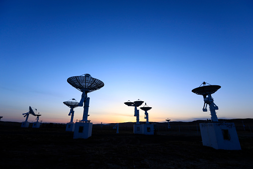 The observatory in the evening, the silhouette of the radio telescope