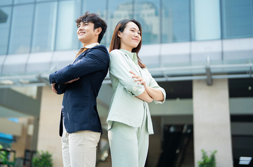 Photo of two young Asian businesspeople