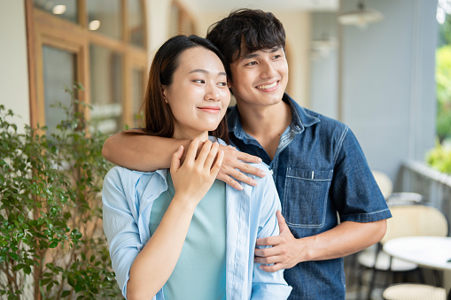 Photo of young Asian couple hang out together