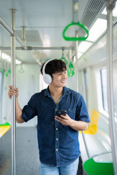 istock Young Asian man on the metro 2017256416