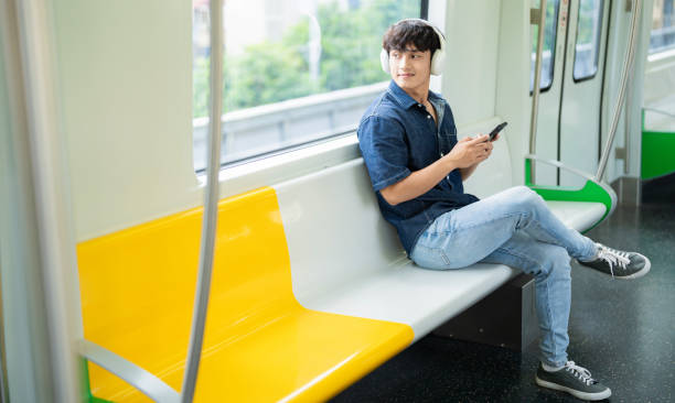 istock Young Asian man on the metro 2017256422