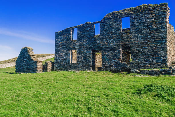 istock Old stone house ruin on a meadow in Shetland 2017285427
