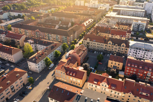 Streets with apartment buildings in evening sunlight Aerial view of city streets with apartment buildings in central Jönköping in summer. jonkoping stock pictures, royalty-free photos & images