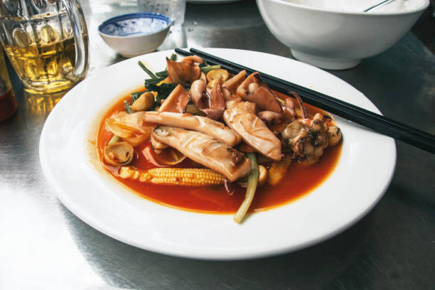 istock Plate with seafood. Vietnamese meal. Squid cuisine with chopsticks. 2017301579