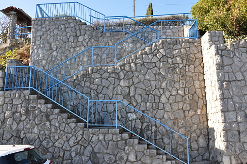 Detail of an historical and monumental old croatian chiseled stone staircase.