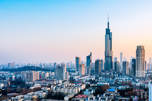 Zifeng Tower and the city skyline at dusk in Nanjing, Jiangsu Province, China