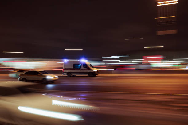 istock An ambulance on the road at night with a blurred background when driving 2017411220