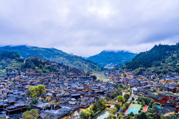 High View Night Scenery of Miao Village in Xijiang, Guizhou, China High View Night Scenery of Miao Village in Xijiang, Guizhou, China qiandongnan miao and dong autonomous prefecture stock pictures, royalty-free photos & images